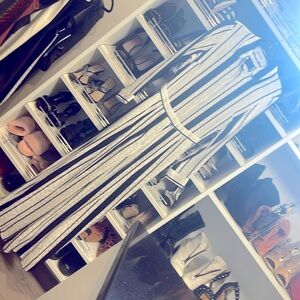 Elegant black and white striped satin jumpsuit for BeBe  buttons down the frot